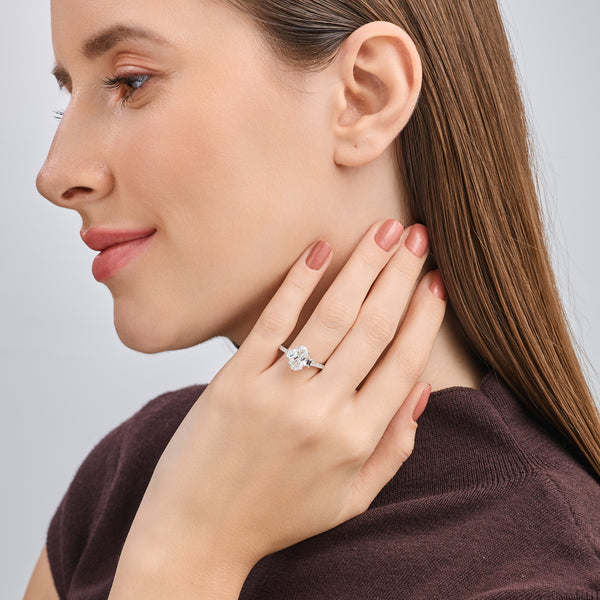 2 and 1/2 Carat Lab-Grown Diamond Oval-Shaped Solitaire Plus Engagement Ring with Baguette Accents and a Classic Shank — GILDED New York