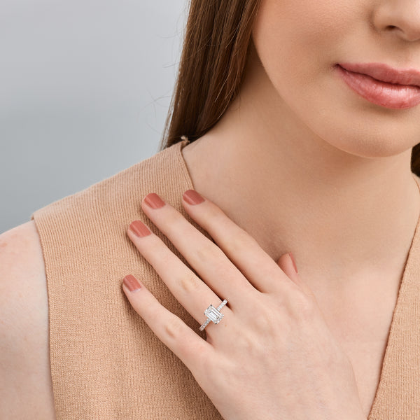 Gilded 2 and 1/2 Carat Emerald-Cut Solitaire Plus Engagement Ring with a Classic Shank
