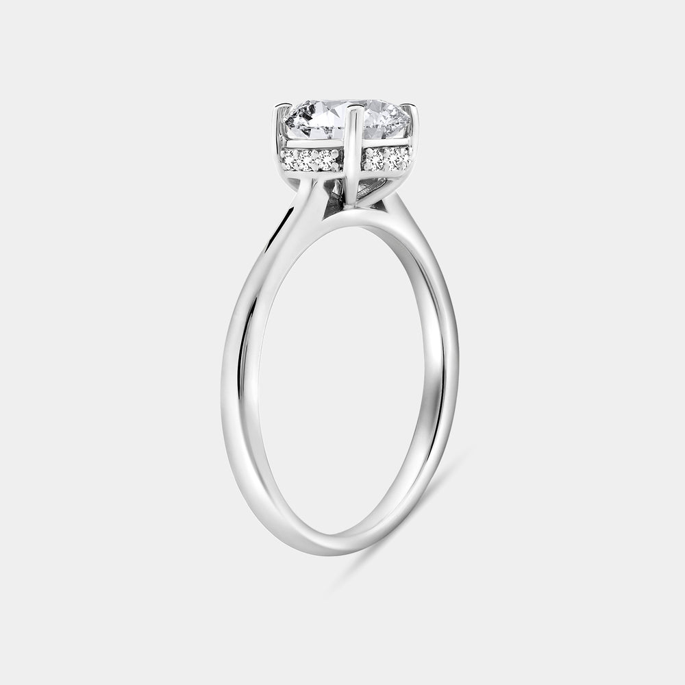 Gilded 1 and 1/3 Carat Lab-grown Diamond Round-Shaped Solitaire Ring with a Side Detail Halo