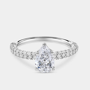 Gilded 1 and 1/2 Carat Lab-Grown Diamond Pear-Shaped Solitaire Plus Ring with a Pavé Shank