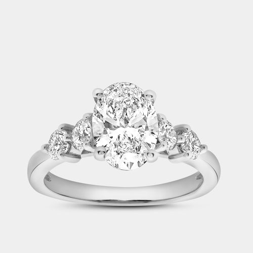 Gilded 2 Carat Lab-Grown Diamond Oval-Shaped Solitaire Plus Engagement Ring with Round-Shaped Accents On The Shank
