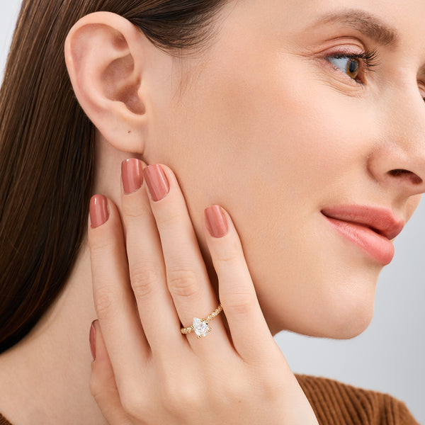 Gilded 1 and 1/4 Carat Lab-Grown Diamond Pear-Shaped Solitaire Plus Engagement Ring with a Twisted Shank