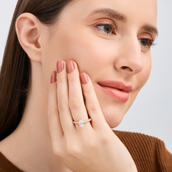 Gilded 1 and 1/2 Carat Lab-Grown Diamond Oval-Shaped Solitaire Plus Ring with a Pavé Shank