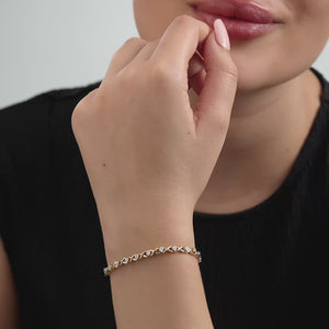 Gilded 1/4 Carat Fashion Bracelet with Xo-Shaped Centers in an Illusion-Plate Setting